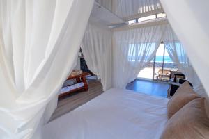 Postel nebo postele na pokoji v ubytování Hotel Puntagrande