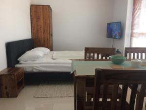 Ένα ή περισσότερα κρεβάτια σε δωμάτιο στο Kropla Bałtyku Darłówko Apartament ECCO