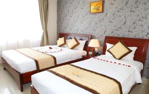 Postel nebo postele na pokoji v ubytování Corvin Hotel