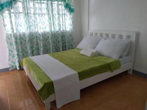 Postel nebo postele na pokoji v ubytování Diodeth's Holiday Apartments