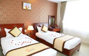 Postel nebo postele na pokoji v ubytování Corvin Hotel