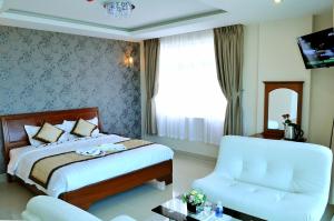 Postel nebo postele na pokoji v ubytování Corvin Hotel