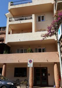 a building with a no parking sign in front of it at Bike&Boat Argentario Hotel in Porto Santo Stefano