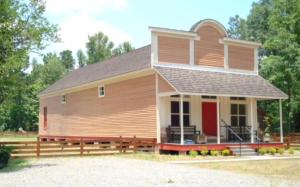 a large wooden house with a red door at Coulter Farmstead in Washington