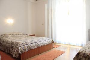 Postel nebo postele na pokoji v ubytování Apartments and rooms Jagoda - comfy and cozy
