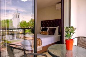 Voodi või voodid majutusasutuse Hotel Alamos Del Parque toas