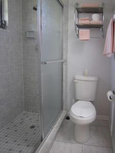 a bathroom with a shower and a toilet at Vacation Home Falcon in Lehigh Acres