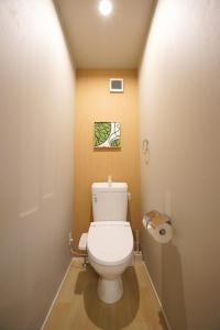 a bathroom with a white toilet in a room at Koti Sopo Universal Bay 1 by Liaison in Osaka +71 photos
