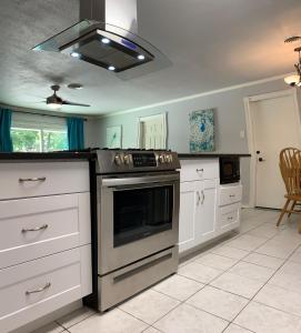 a kitchen with a stove top oven in a room at The Peahen House in San Antonio