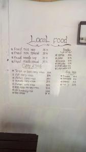 a whiteboard with the wordscial food written on it at Aladdin Homestay in Gili Air