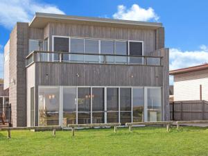 a building with large glass windows on the side of it at 38 Oceane in Port Fairy