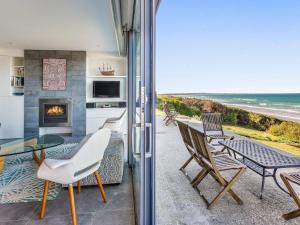 a living room with a view of the ocean at Aqua Mist in Port Fairy