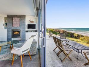 a living room with a view of the ocean at Aqua Mist Seascape in Port Fairy