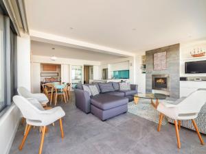 a living room with a couch and a table at Aqua Mist Seascape in Port Fairy