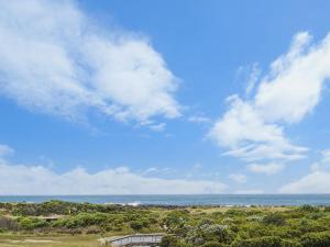 a view of the ocean with a blue sky and clouds at Bella On Victoria in Port Fairy