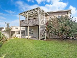 a large house with a porch and a staircase at Escape 2 Brophy in Port Fairy
