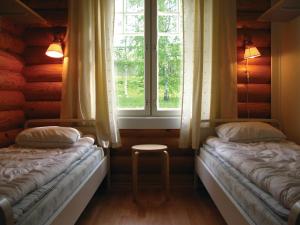 Postel nebo postele na pokoji v ubytování Marttinen