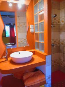 a bathroom with a white sink and a mirror at hotel trecicogne in Morondava +49 photos