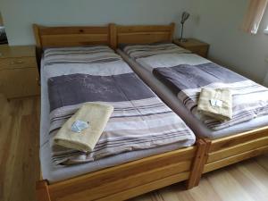 Postel nebo postele na pokoji v ubytování Hotel Berounka