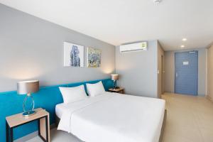 Xen Hotel Nakhon Pathom - SHA PLUS客房内的一张或多张床位