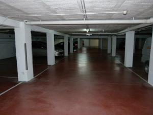 an empty parking garage with cars parked in it at Hotel Alameda in Zarautz