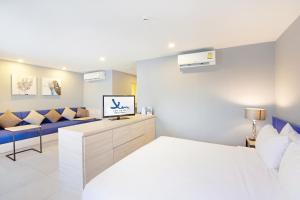Xen Hotel Nakhon Pathom - SHA PLUS客房内的一张或多张床位