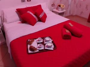 A bed or beds in a room at Hotel Tiffany