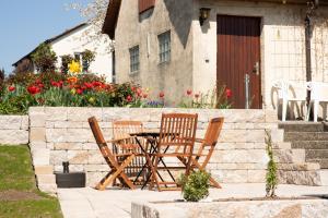 a table and chairs in front of a house at FeWo Meersburg in Meersburg