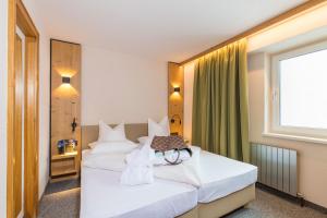Voodi või voodid majutusasutuse Hotel Falknerhof toas