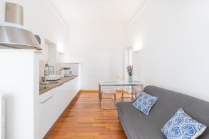 a living room with a couch and a table at Stay In Rome in Rome