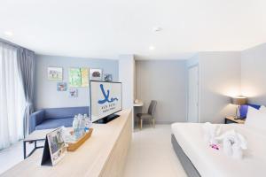 Xen Hotel Nakhon Pathom - SHA PLUS客房内的一张或多张床位