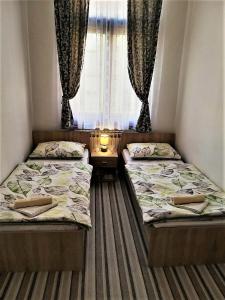 Postel nebo postele na pokoji v ubytování TOMISLAV