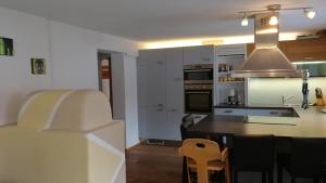 a kitchen and dining room with a table and chairs at Ferienwohnung Philipp in Leutasch +10 photos