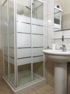 a bathroom with a shower and a sink at Monolocale Azzurra in Magione +38 photos