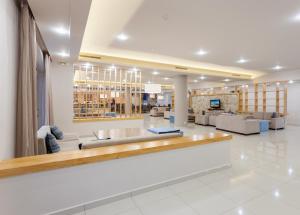 a lobby of a hospital with couches and chairs at Alykanas Village Resort in Alikanas +83 photos