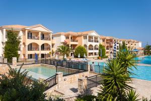 a view of a resort with a swimming pool at Alykanas Village Resort in Alikanas