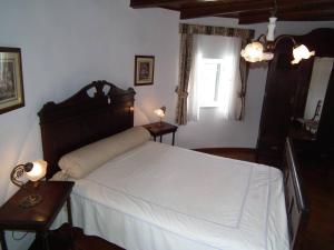 Łóżko lub łóżka w pokoju w obiekcie Moinho de Paradela Novo mit Pool