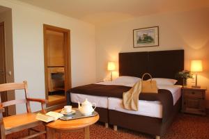 Postel nebo postele na pokoji v ubytování Hotel Zamek Bobolice + 37 fotografií