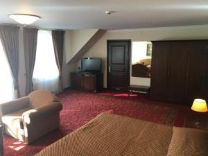 TV a/nebo společenská místnost v ubytování Guest House Pirklių Namai