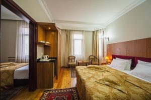 Postel nebo postele na pokoji v ubytování Hippodrome Hotel