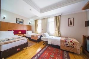 Postel nebo postele na pokoji v ubytování Hippodrome Hotel
