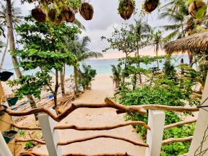 a view of the beach from a resort gate at Kaiyana Boracay Beach Resort in Boracay