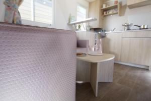 a kitchen with a small table in a room at Càmping Bellsol in Pineda de Mar