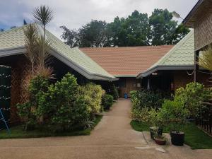 a house with a walkway in front of it at Hope Homes in Panglao