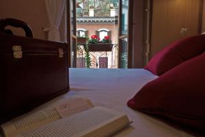 Letto o letti in una camera di Hotel Concordia