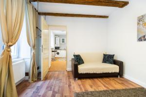 a living room with a couch and a window at Lamp House in Braşov