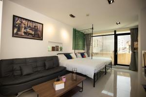 Postel nebo postele na pokoji v ubytování YouI98 Guesthouse一層一戶大坪數套房#本國旅客須先匯款