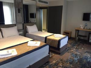 Ein Bett oder Betten in einem Zimmer der Unterkunft Taksim Pera Orient Hotel