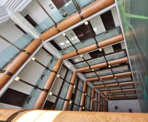 a room with pipes on the ceiling at Principi di Piemonte | UNA Esperienze in Turin