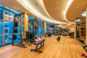 a gym with treadmills and cardio equipment in a building at LuxBnB - Park Towers - DIFC in Dubai